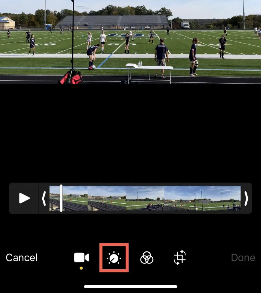 Click the "Adjust" button in Photos for iOS to adjust video exposure